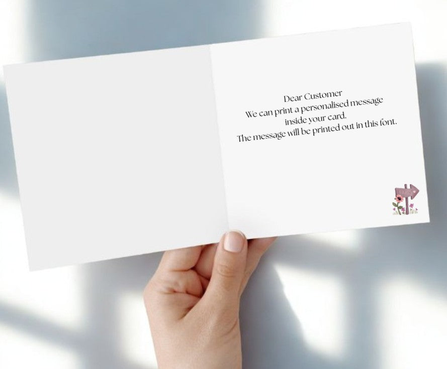 Hand holding a white card with text and a logo on a light gray background