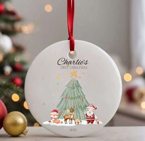Personalised Christmas ornament with Santa, reindeer, and tree design, featuring 'Charlie's First Christmas' text.