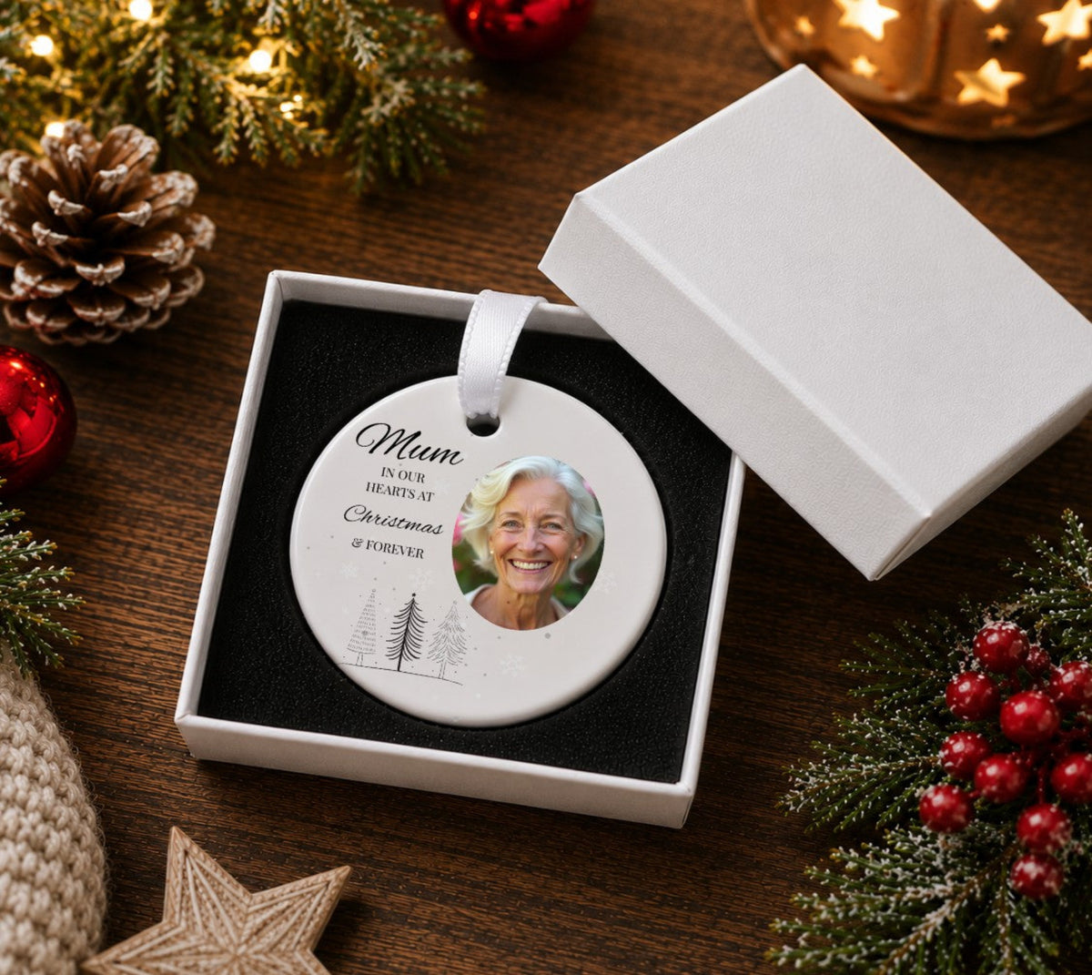 ceramic Christmas bauble with a photo and text reading MUM in our hearts at Christmas & forever presented i a gift box