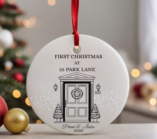 Decorative Christmas ornament with a door illustration and text, hanging against a festive background.