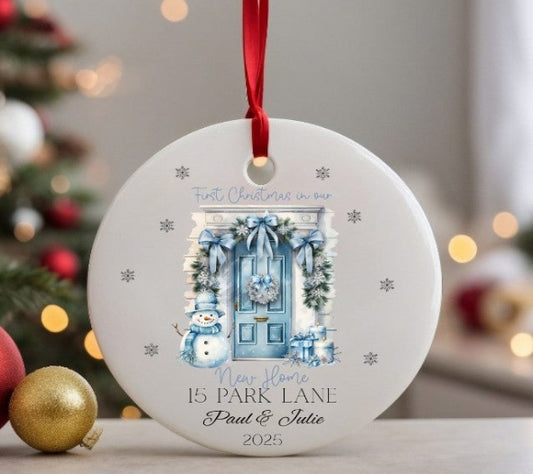 Personalised Christmas ornament with festive design and text, hanging against a blurred Christmas tree background.