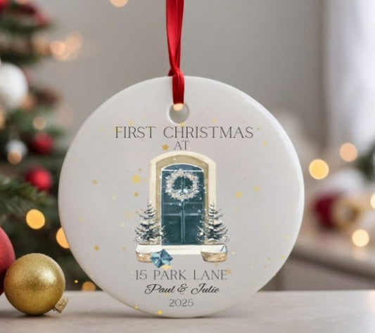 Personalised Christmas ornament with a festive design and text, placed on a surface with a blurred Christmas tree in the background.
