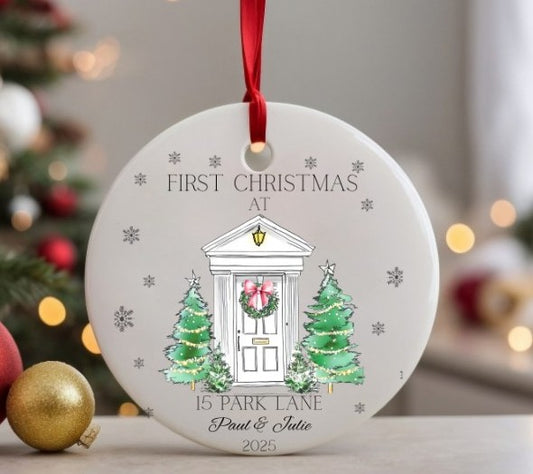 Personalised Christmas ornament with a door, trees, and wreath design, featuring the text 'First Christmas at 15 Park Lane Paul & Julie 2025'.