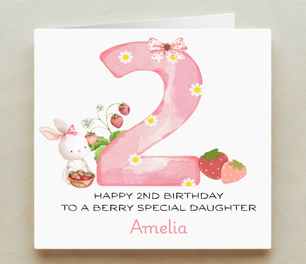 Birthday card with number '2', rabbit, strawberries, and flowers on a white background