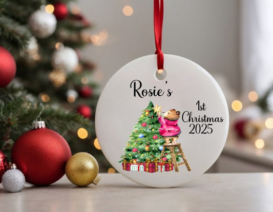 white ceramic Christmas bauble with a Christmas tree and pink London bear