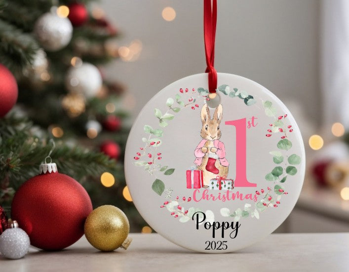 round ceramic Christmas ornament with a pink bunny design with the number one